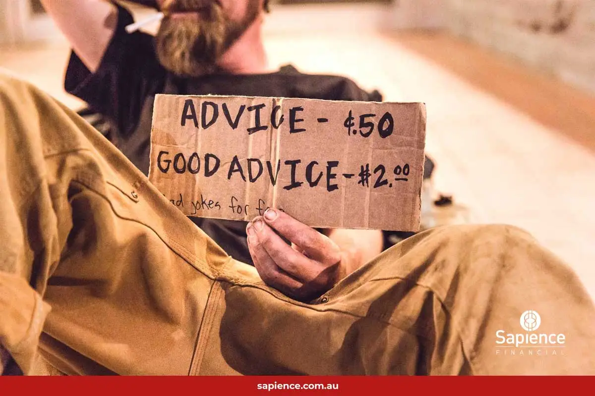 homeless person with cardboard sign