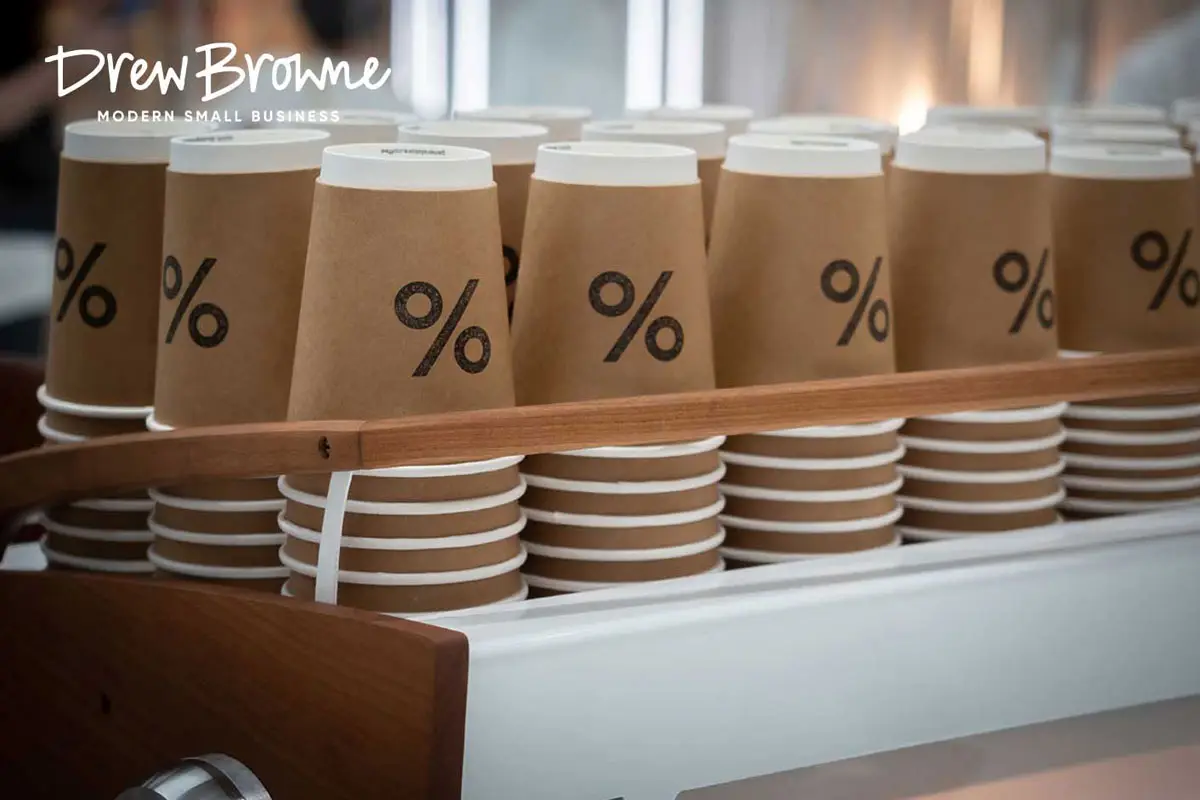 stacks of paper coffee cups at a cafe