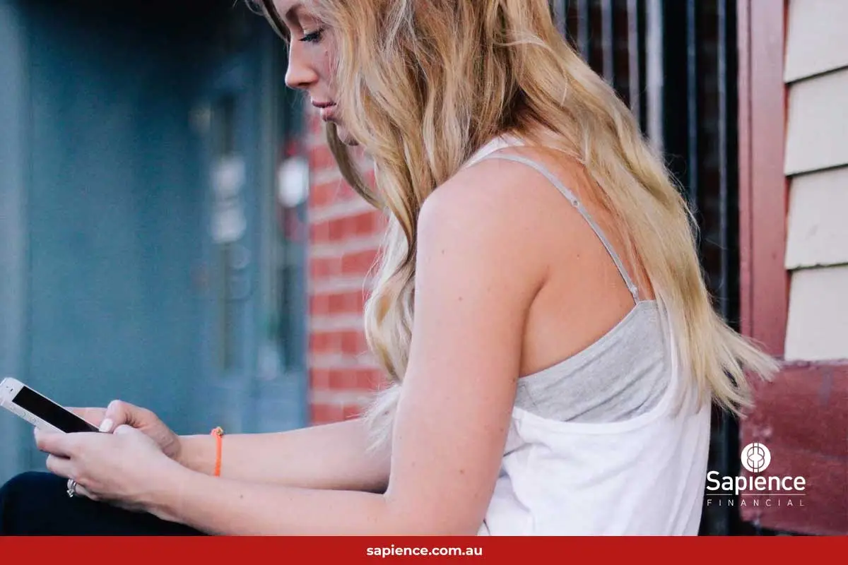 teenage girl txting on phone