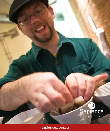 smiling barista making coffee