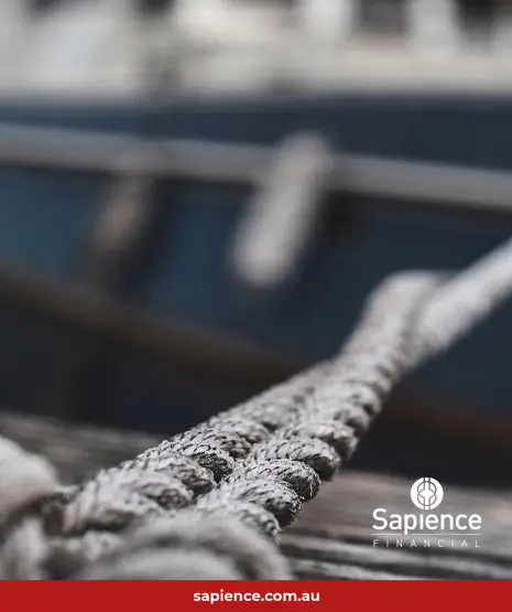 sea going vessel roped to the dock straining at the mooring ropes