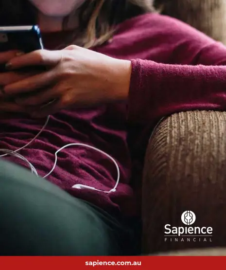 person sitting on sofa listening to music