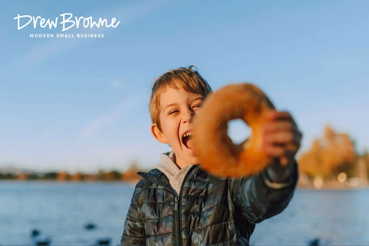 happy young boy with his bagel